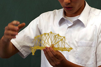 Students created bridges using pasta in a seminar