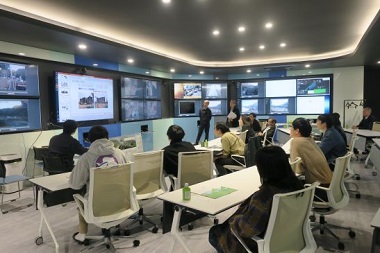 Image: Scholarship students asking about general construction details at an on-site office