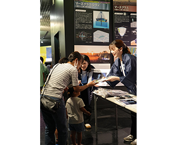 Image: Distributing promotional items