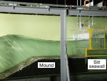 Wave force effects on seawall with slit type wave absorbing structure