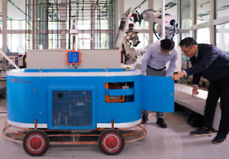 Development status of concrete-floor-finishing robot